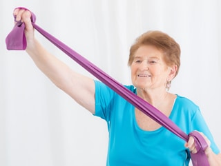 a woman holding a purple band